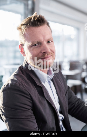 Portrait of confident businessman sitting at restaurant Stock Photo