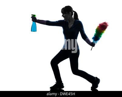 one  woman maid dust cleaning in silhouette studio isolated on white background Stock Photo