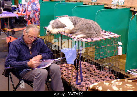 Birmingham, UK. 6th March 2014. Crufts 2014 dog show in NEC national exhibition centre Birmingham UK England day one of the  premier dog show and competition. relaxing with pet in prep preparation area  Credit:  Paul Thompson Live News /Alamy Live News Stock Photo