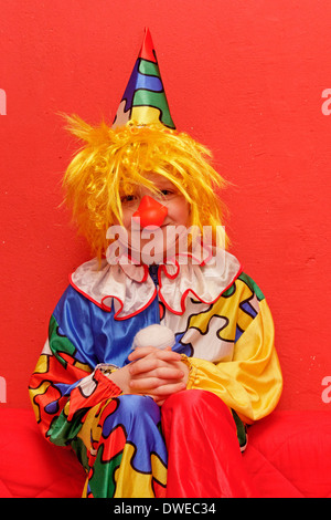 young boy dressed up as a clown Stock Photo