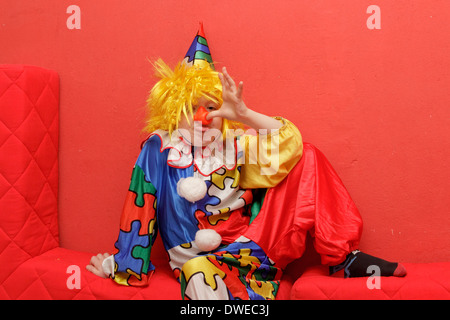 young boy dressed up as a clown Stock Photo