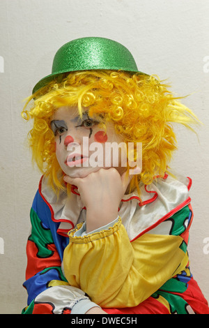 young boy dressed up as a clown Stock Photo