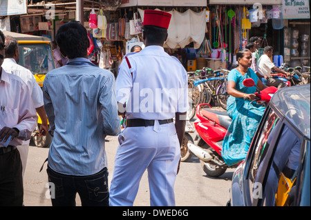 India , Tamil Nadu , Pondicherry , Puducherry , policeman police officer French style red kepi & white uniform watch traffic Stock Photo