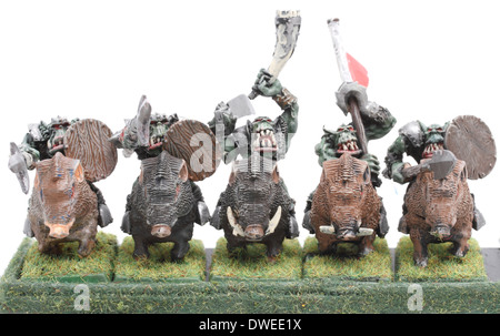 Orc Boar Boyz mounted on war Boars, with banner bearer and musican (horn) painted by photographer Stock Photo