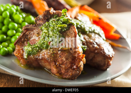 Homemade Cooked Lamb Chops with Peas and Carrots Stock Photo