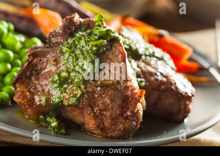 Homemade Cooked Lamb Chops with Peas and Carrots Stock Photo