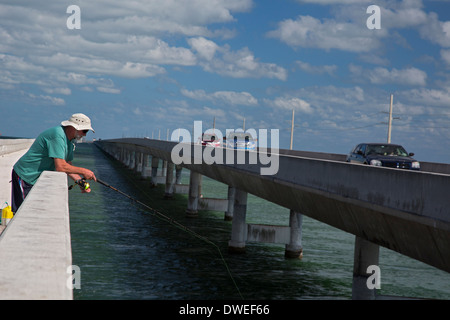 Little Duck Key, Florida - A man fishes from the Florida Keys Overseas Heritage Trail. Stock Photo