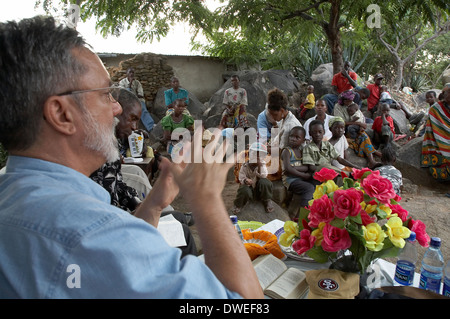 TANZANIA Gathering with an American Catholic missionary priest in Mwanza. Stock Photo