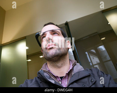 Young man wearing Google Glass