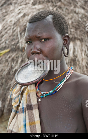 Surma women with lip plate in the water, Kibish, Omo River Valley Stock ...