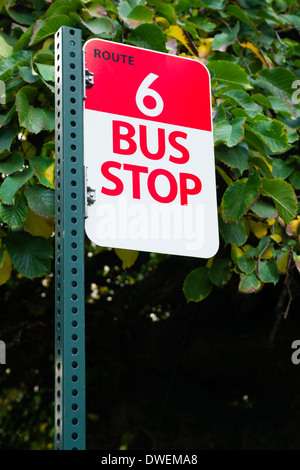 Red and White Sign marks route 6 and the stop to get on and off the bus Stock Photo