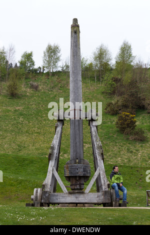 Replica of wooden trebuchet on the path leading to the Urquhart Castle, a medieval weapon of war, a siege instrument, visitor Stock Photo
