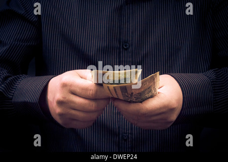 Closeup of a man for calculating Polish money Stock Photo