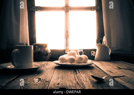 Old kitchen table in a rural cottage in the morning Stock Photo