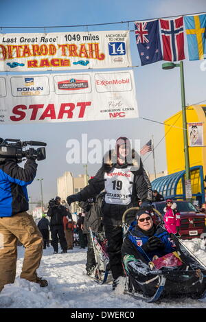 Anchorage, Alaska, USA. 1st Mar, 2014. Iditarod musher ALLEN MOORE leaves the start of Iditarod. Mushers drive though downtown Anchorage for the ceremonial start of the Iditarod Sled Dog Race. © Ron Levy/ZUMA Wire/ZUMAPRESS.com/Alamy Live News Stock Photo