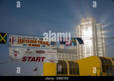 Anchorage, Alaska, USA. 1st Mar, 2014. Rays of hope lasted about a minute at the start of Iditarod 62. Mushers drive though downtown Anchorage for the ceremonial start of the Iditarod Sled Dog Race. © Ron Levy/ZUMA Wire/ZUMAPRESS.com/Alamy Live News Stock Photo