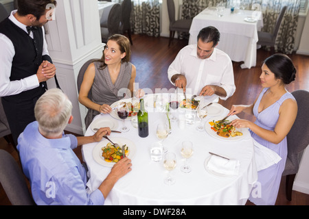 Business colleagues around dining table in restaurant Stock Photo