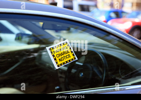 Parking charge notice on a car window Stock Photo
