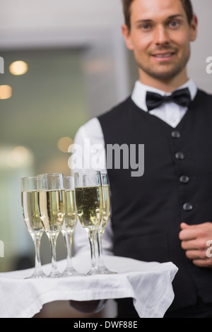 Waiter holding tray of champagne Stock Photo