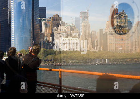 Reflection on the boat of Staten Island. Staten Island is one of the five boroughs of New York and one of the biggest tourist Stock Photo