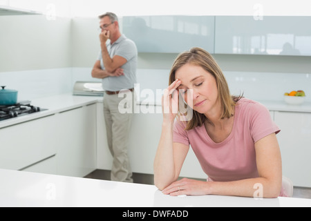 Couple not talking after an argument in kitchen Stock Photo