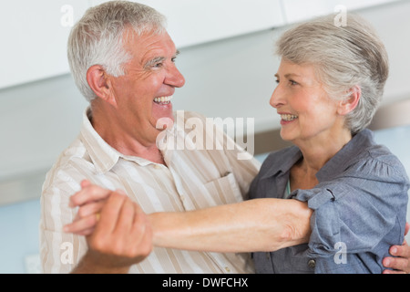 Happy senior couple dancing together Stock Photo