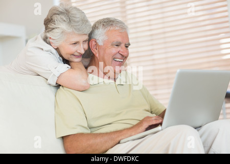 Happy senior couple using the laptop together Stock Photo