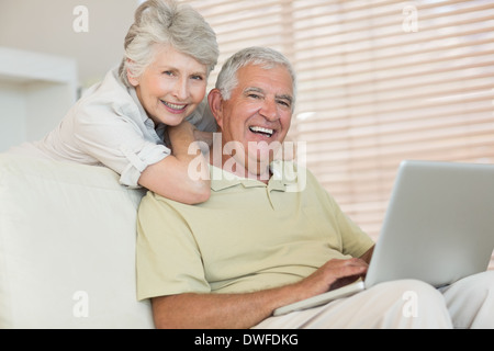 Happy senior couple using the laptop together Stock Photo