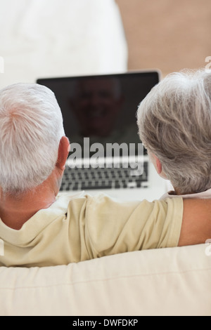 Happy senior couple using the laptop together Stock Photo