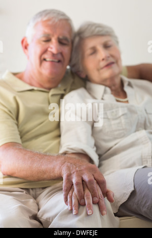 Senior couple napping on the couch Stock Photo