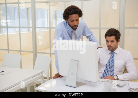 Businessmen working on computer in office Stock Photo