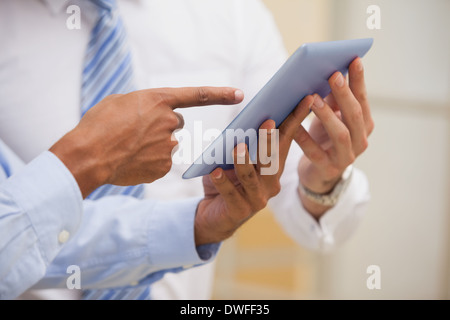 Mid section of businessmen using digital tablet Stock Photo