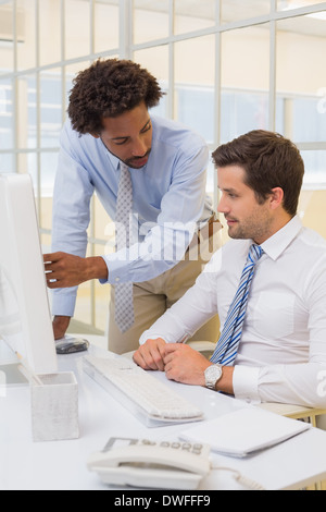 Businessmen working on computer in office Stock Photo