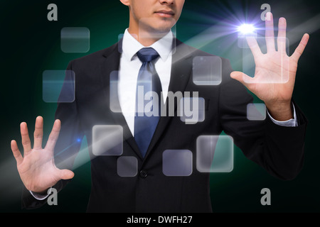 Businessman touching interface Stock Photo