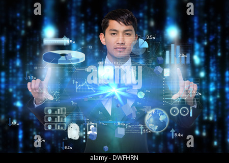 Serious businessman touching interface Stock Photo