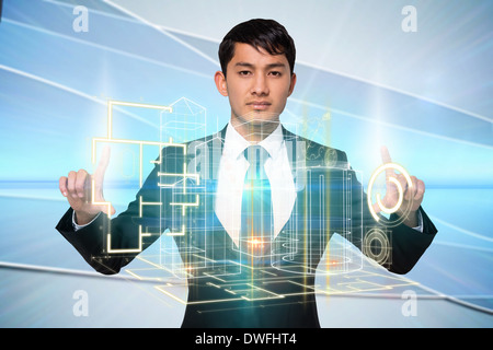Serious businessman touching interface Stock Photo