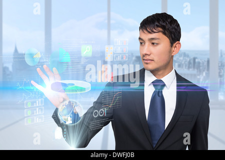 Asian businessman touching interface Stock Photo