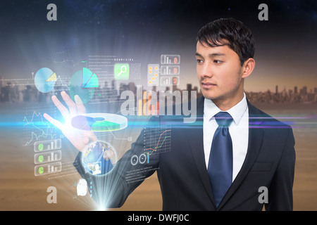Asian businessman touching interface Stock Photo