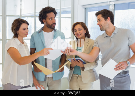 Business colleagues with documents in office Stock Photo