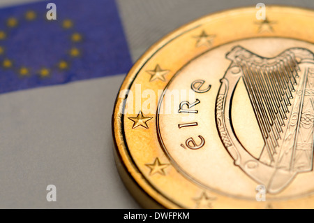 Irish 1 Euro coin on €5 Euro note Stock Photo