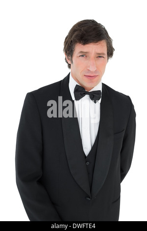 Portrait of groom in tuxedo Stock Photo
