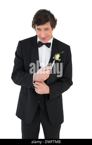 Smiling groom in tuxedo getting ready Stock Photo