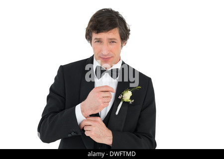 Groom in tuxedo getting ready Stock Photo