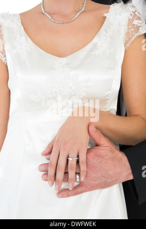 Newly married couple showing wedding rings Stock Photo