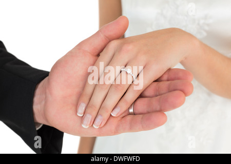 Cropped image of newly wed couple holding hands Stock Photo