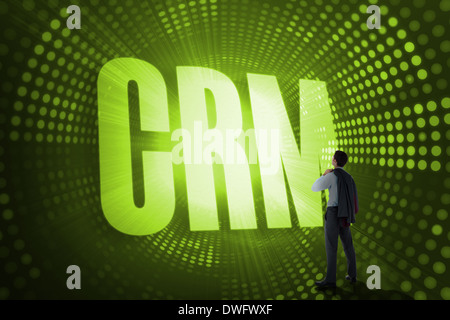 Crm against green pixel spiral Stock Photo