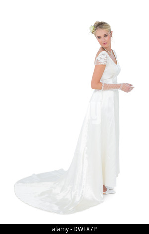Thoughtful bride looking over shoulder Stock Photo