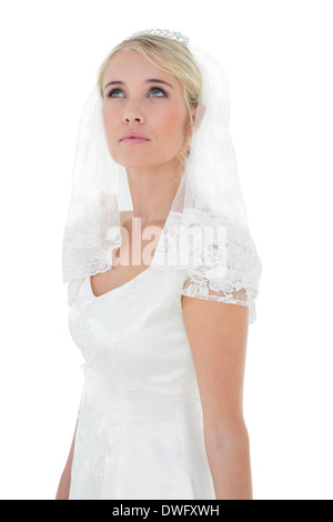 Bride looking up over white background Stock Photo