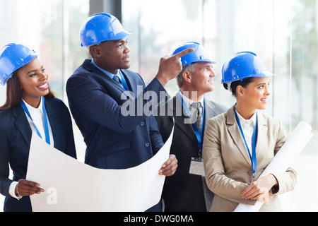 successful construction team discussing architectural project Stock Photo