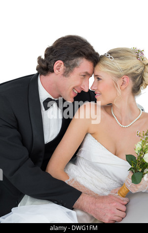 Attractive bride and groom with head to head Stock Photo